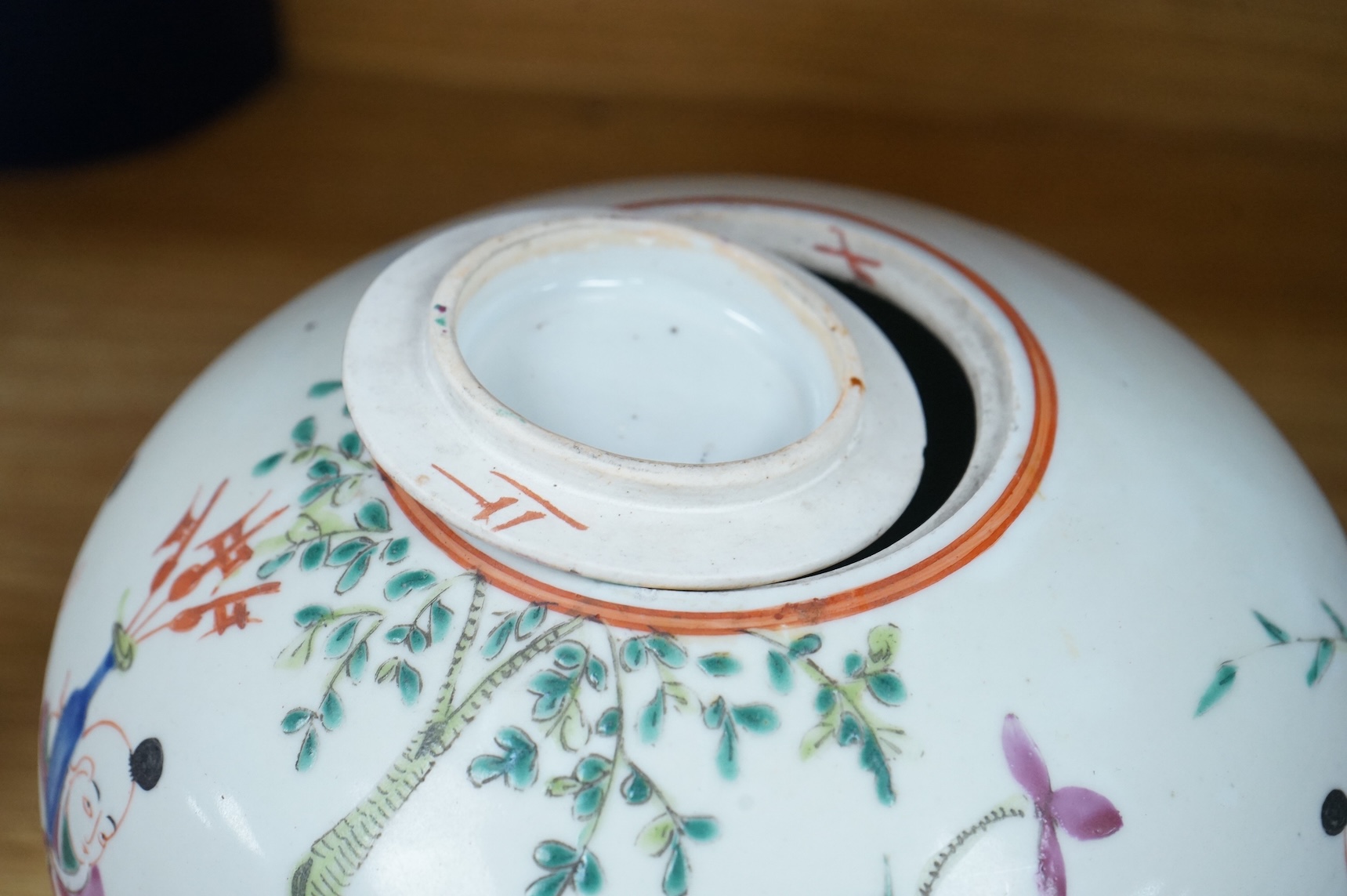 A 19th century Chinese famille rose 'Boys' jar and cover, 19cm